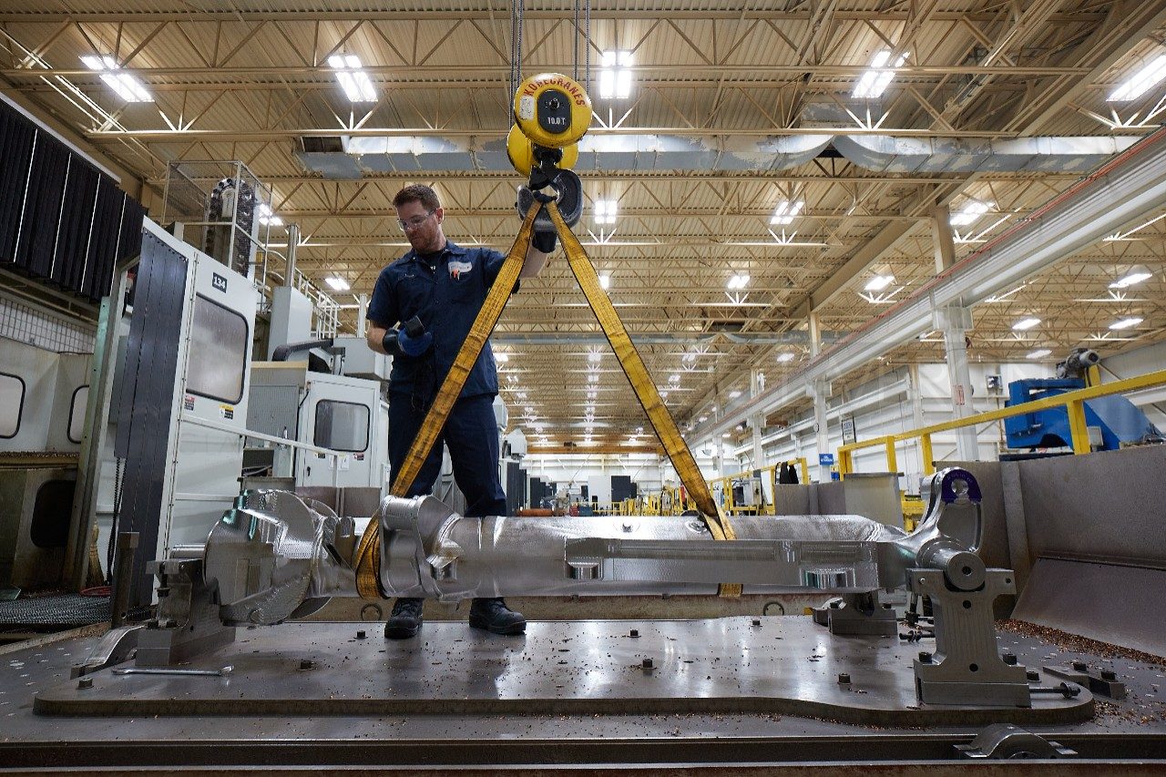 Kitchener employee inspecting a piece of equipment